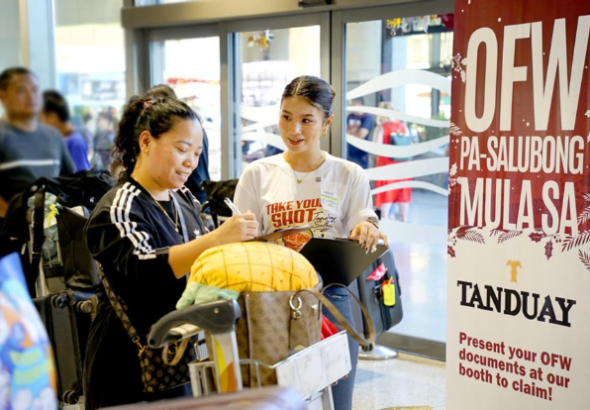 Tanduay Gives Homecoming Gifts to Returning OFWs at Cebu Airport