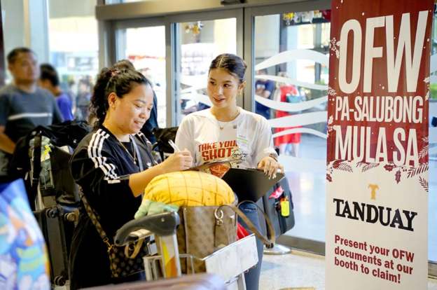 Tanduay Gives Homecoming Gifts to Returning OFWs at Cebu Airport